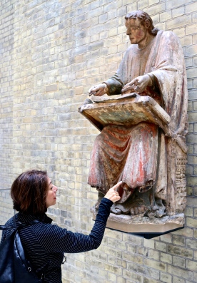 Rosemary points out paint on old sculpture